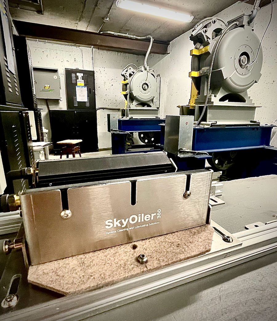 Metalworking machine with 'SkyOiler' branding in an industrial setting